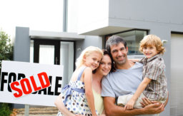 portrait of a happy family buying a house